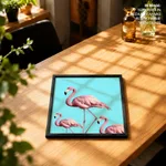 Three pink flamingo